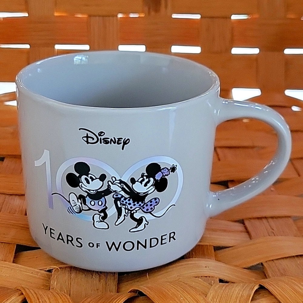 DISNEY 100 YEARS OF WONDER MUG, 15OZ, MICKEY/MINNIE DANCING +6 MORE ON FLIP SIDE